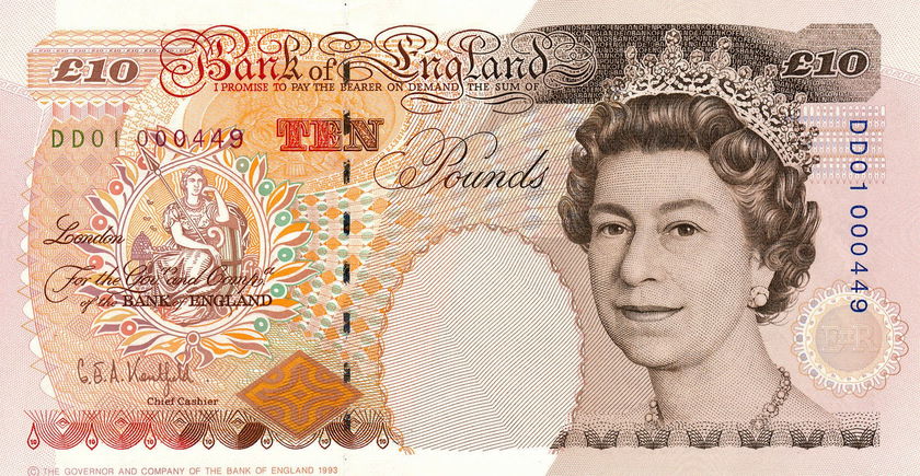 A British £10 banknote featuring a portrait of Queen Elizabeth II on the right, intricate security patterns, a seated Britannia figure on the left, and ornate lettering—an elegant reminder of The Queen’s Platinum Jubilee.